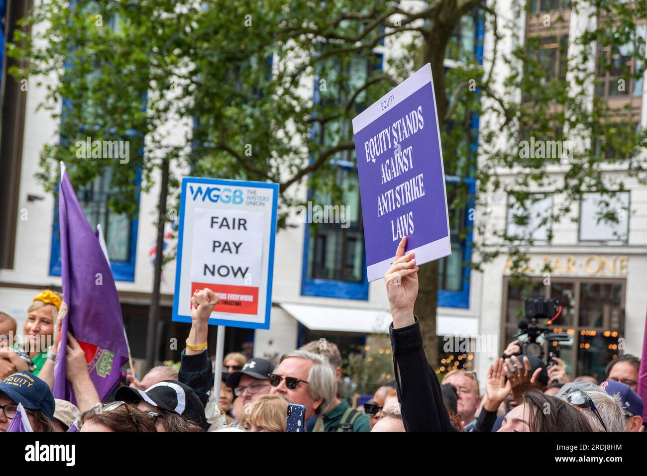 London, UK. 21st July, 2023. Protesters hold placards during the demonstration. Equity held a protest at the Leicester Square by the William Shakespeare sculpture to show their solidarity with the Sag-Aftra in the US. Along the Labour MP John McDonnell many famous British actresses and actors attended the demonstration like Brian Cox, Andy Serkis, Rob Delaney, Simon Pegg, Jim Carter and Imelda Staunton. (Photo by Krisztian Elek/SOPA Images/Sipa USA) Credit: Sipa USA/Alamy Live News Stock Photo