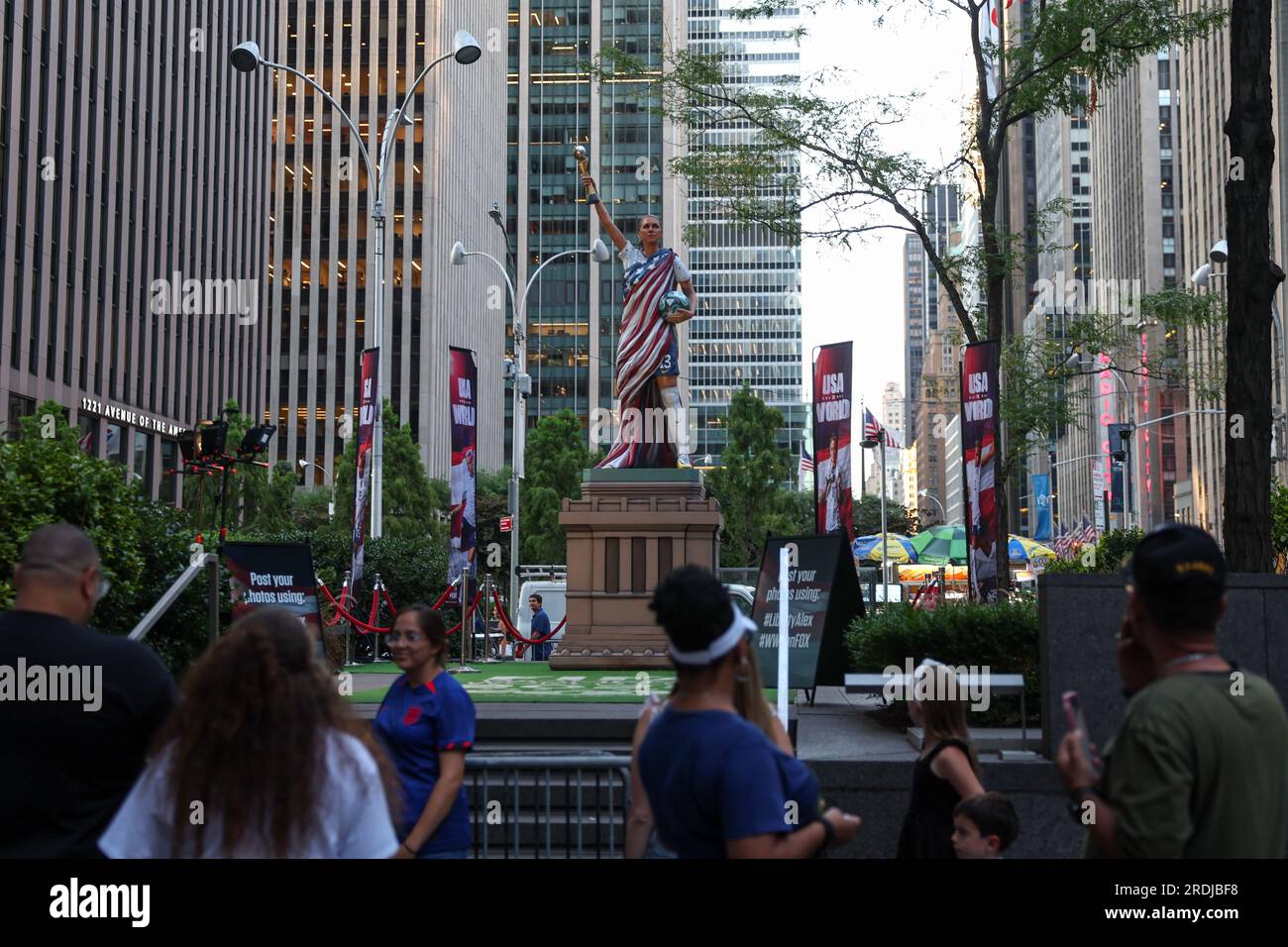 A statue of USWNT player Alex Morgan stands in Fox Square on July 21, 2023 in New York City. As the 2023 FIFA Women's World Cup gets under way, an 825-pound statue of soccer legend Morgan wearing her U.S. uniform and holding a World Cup trophy was erected in Fox Square as it makes its rounds on a national tour. The statue, made of reinforced and hard coated foam and 3D-printed resin for the head and trophy, was erected in honor of Morgan and her impact on the USWNT by Fox Sports, and to promote the network's coverage of the World Cup Credit: Brazil Photo Press/Alamy Live News Stock Photo