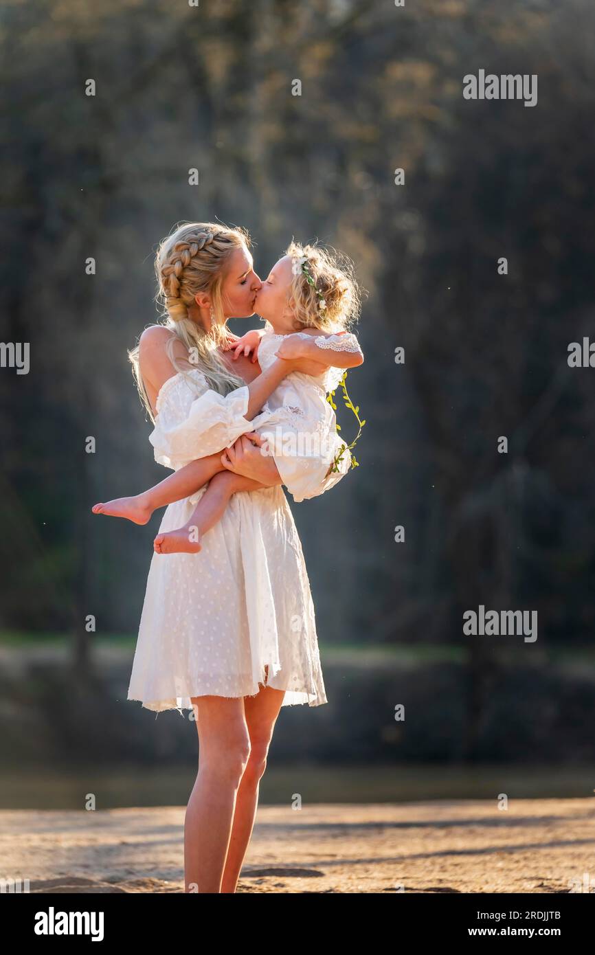 A beautiful young mother and her daughter enjoy the spring weather Stock Photo