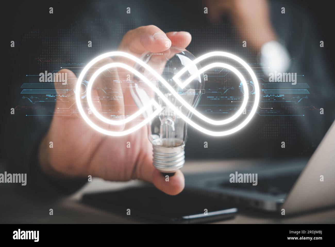 Man emphasizes light bulb with infinite symbol icon Stock Photo - Alamy