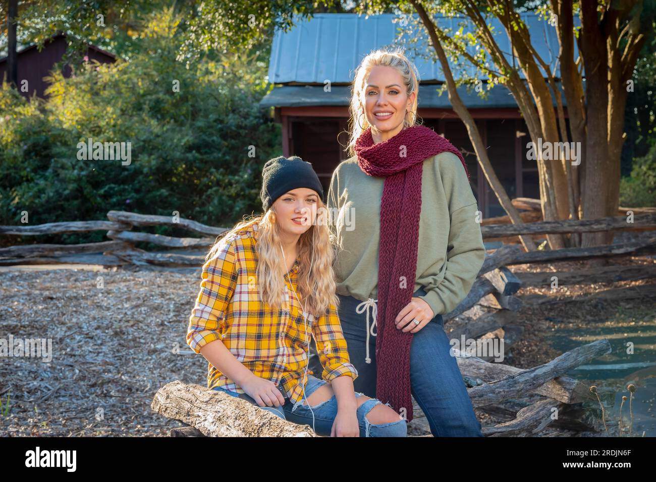 A beautiful young mother and her daughter enjoy the fall weather Stock Photo