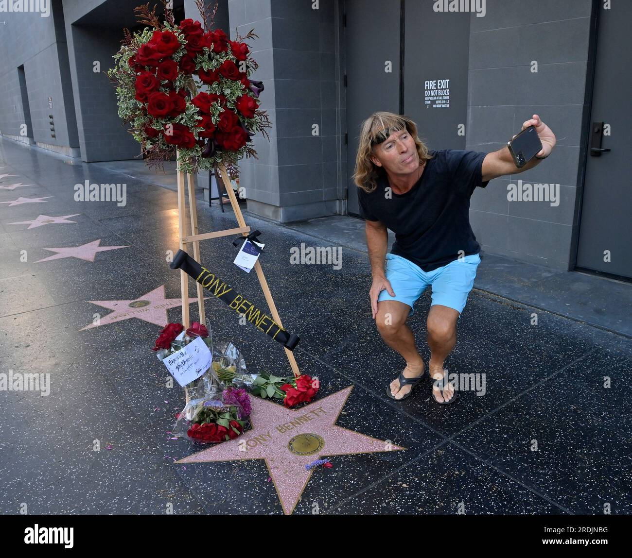 Los Angeles, United States. 21st July, 2023. A fan takes a selfie at singer Tony Bennett's star on Vine Street in the Hollywood section of Los Angeles on Friday, July 21, 2023. Bennett, who released more than 70 albums over a music career that spanned decades, died in his hometown of New York at age 96. Bennett, who earned the admiration of generations of performers from Frank Sinatra to Lady Gaga and Amy Winehouse was a true citizen of the world, an interpreter of the Great American Songbook for fans around the globe. Photo by Jim Ruymen/UPI Credit: UPI/Alamy Live News Stock Photo