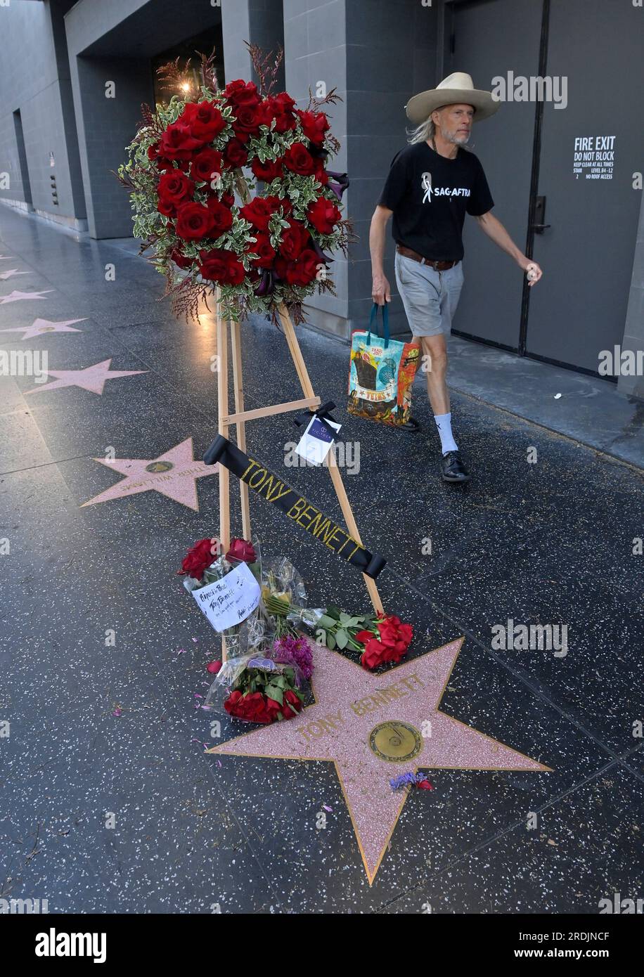 Los Angeles, United States. 21st July, 2023. A SAG-AFTRA member walks past singer Tony Bennett's star on Vine Street in the Hollywood section of Los Angeles on Friday, July 21, 2023. Bennett, who released more than 70 albums over a music career that spanned decades, died in his hometown of New York at age 96. Bennett, who earned the admiration of generations of performers from Frank Sinatra to Lady Gaga and Amy Winehouse was.a true citizen of the world, an interpreter of the Great American Songbook for fans around the globe. Photo by Jim Ruymen/UPI Credit: UPI/Alamy Live News Stock Photo