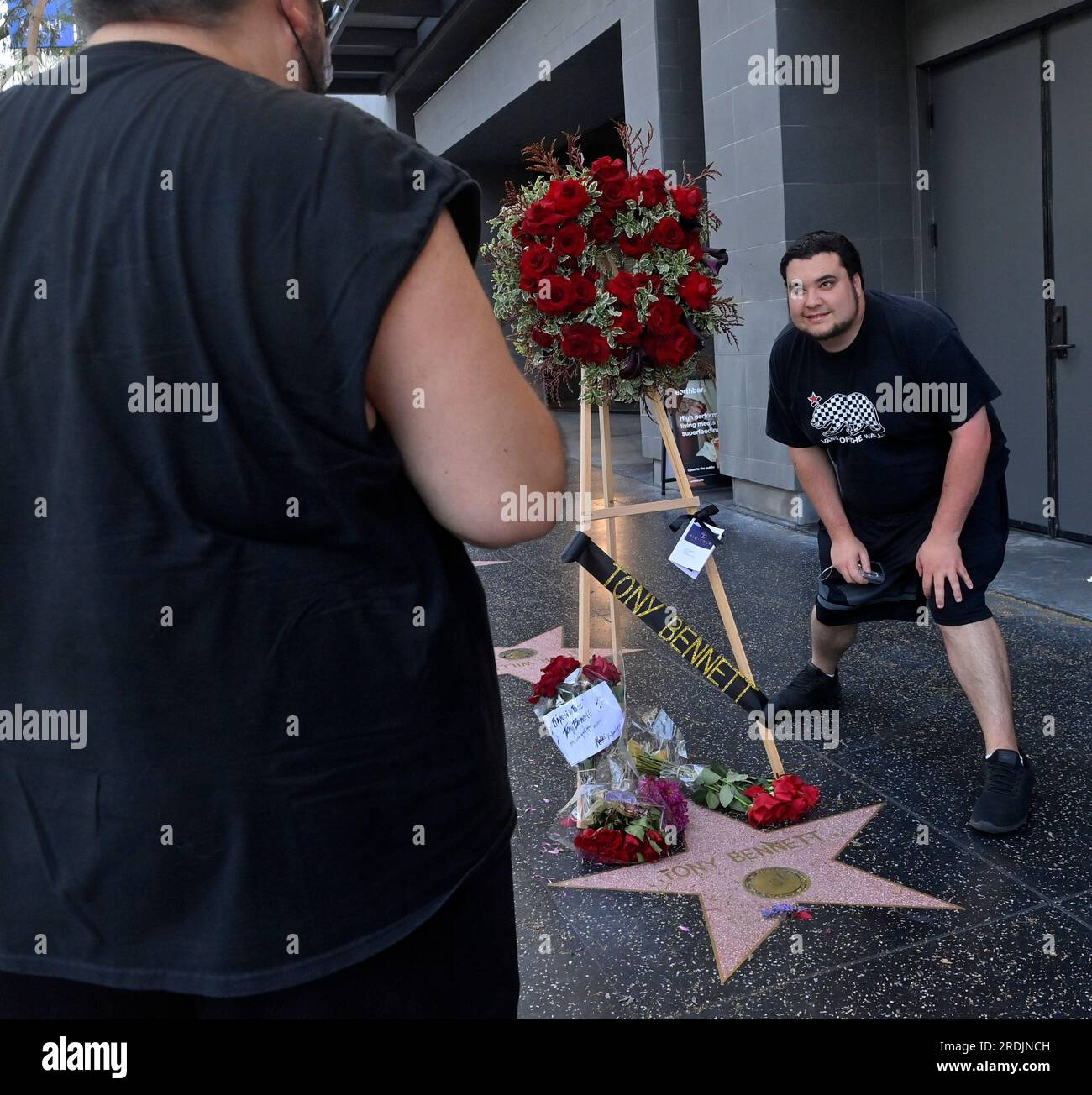 Los Angeles, United States. 21st July, 2023. A fan takes a selfie at singer Tony Bennett's star on Vine Street in the Hollywood section of Los Angeles on Friday, July 21, 2023. Bennett, who released more than 70 albums over a music career that spanned decades, died in his hometown of New York at age 96. Bennett, who earned the admiration of generations of performers from Frank Sinatra to Lady Gaga and Amy Winehouse was a true citizen of the world, an interpreter of the Great American Songbook for fans around the globe. Photo by Jim Ruymen/UPI Credit: UPI/Alamy Live News Stock Photo