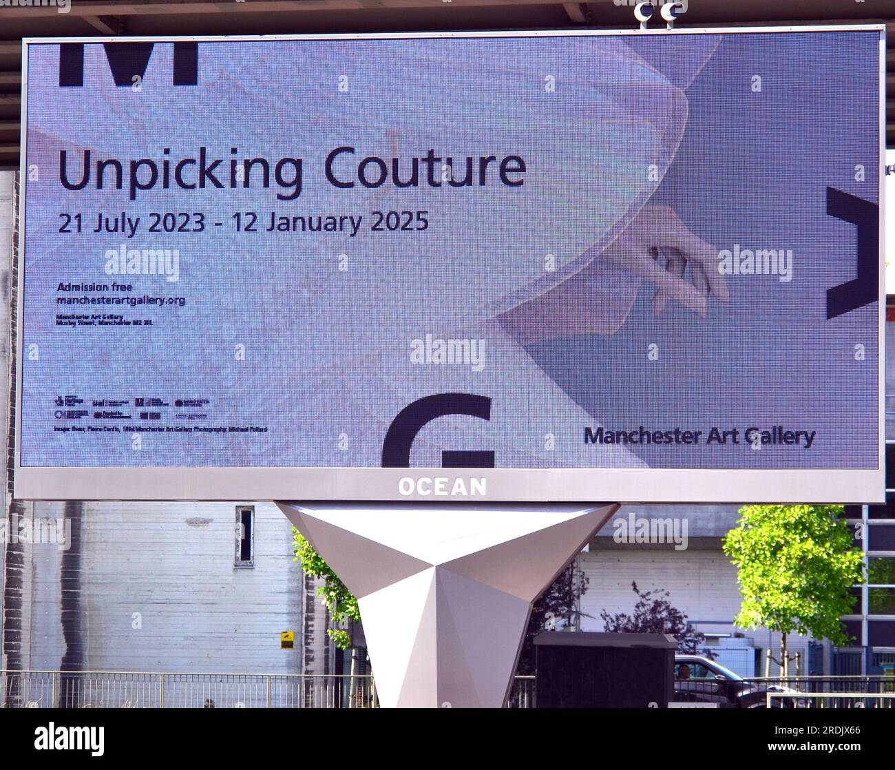An electronic billboard in Manchester, UK, advertises' Unpicking