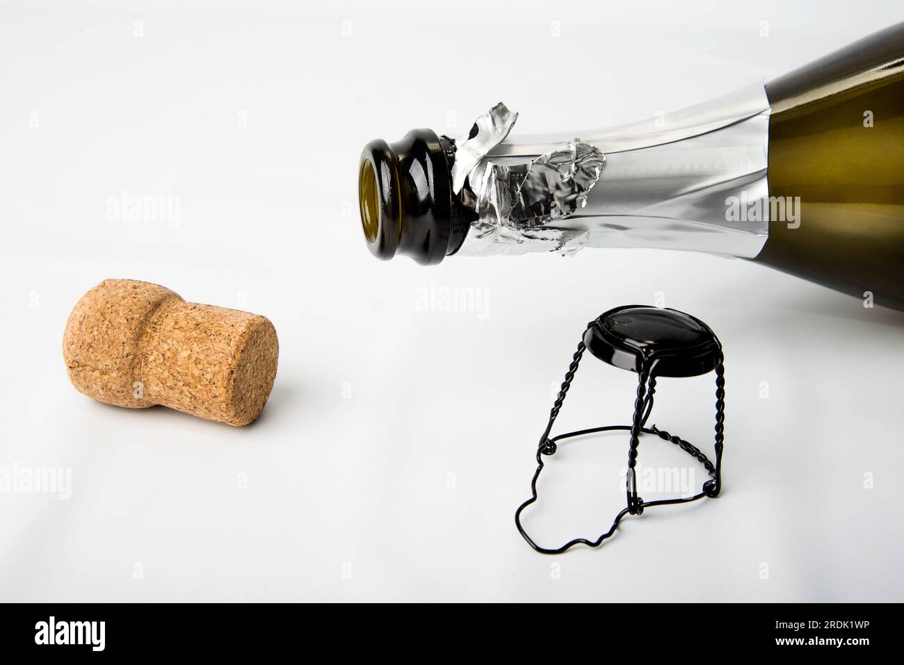 Cork and empty champagne bottle on white Stock Photo