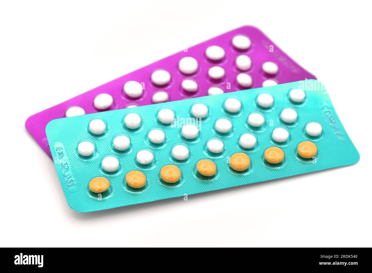 Colorful oral contraceptive pill strips isolated on white background. Stock Photo