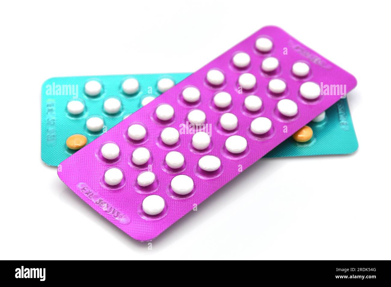 Colorful oral contraceptive pill strips isolated on white background. Stock Photo