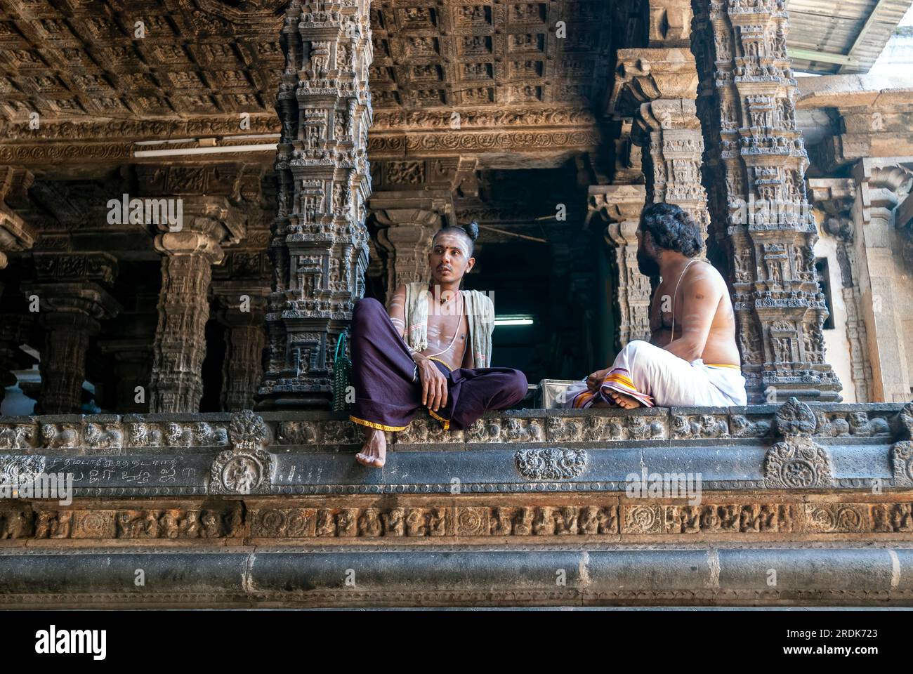 Temple priests at the Nritta Sabha or Hall of Dance with some fine pillars in Thillai Nataraja temple, Chidambaram, Tamil Nadu, South India, India Stock Photo