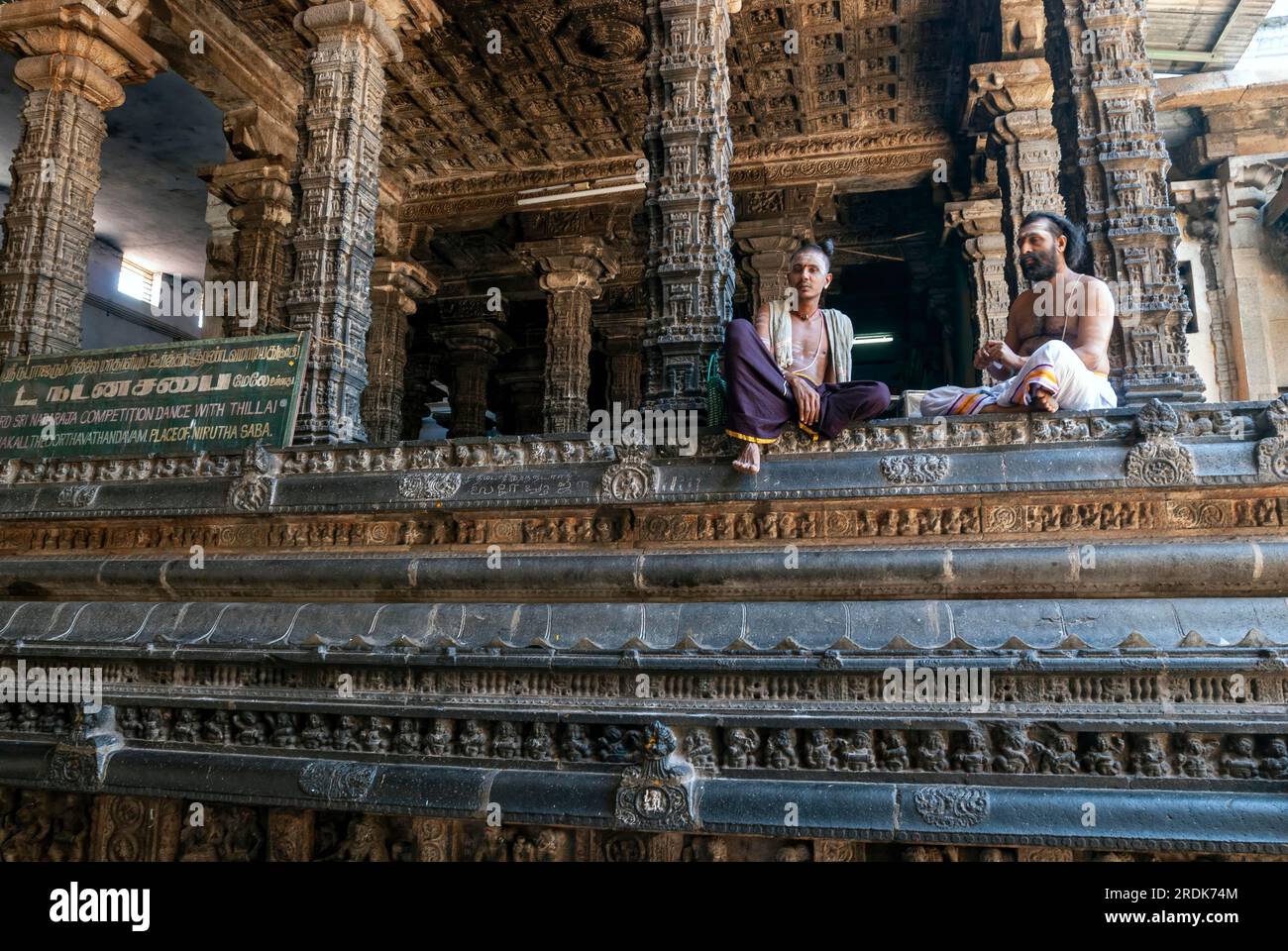 Temple priests at the Nritta Sabha or Hall of Dance with some fine pillars in Thillai Nataraja temple, Chidambaram, Tamil Nadu, South India, India Stock Photo