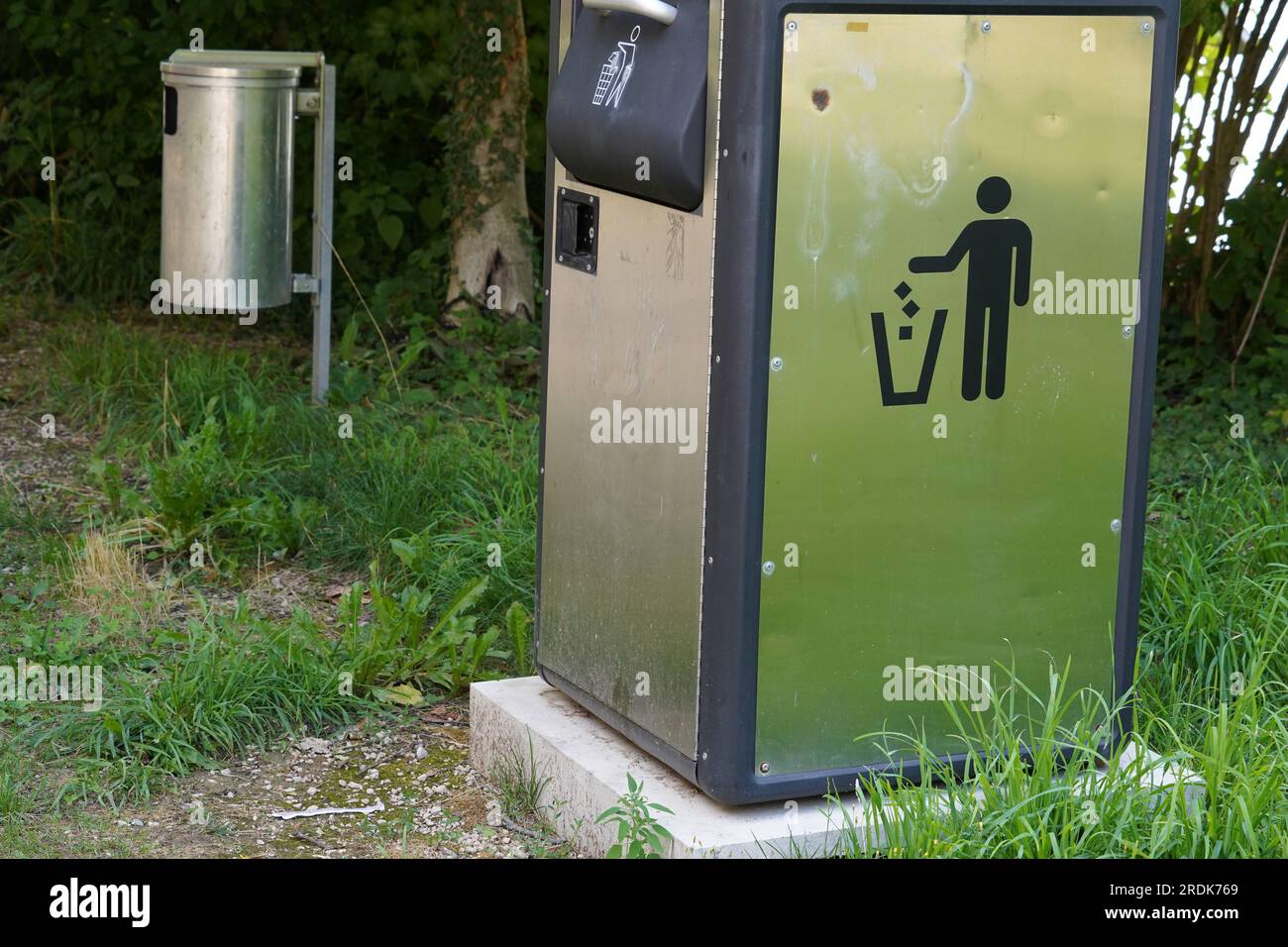 Two metal litter bins in public spaces. Stock Photo