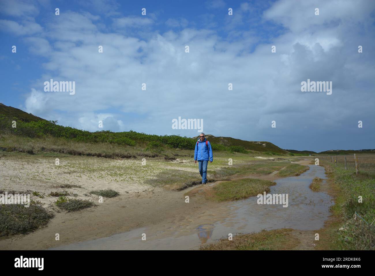 Walking along the Wadden Sea coast near Hörnum, Sylt, Frisian Islands, Germany Stock Photo