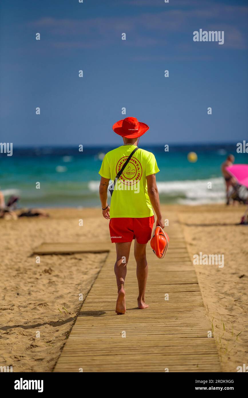 Lifeguard on the Salou beach on a summer day on the Costa Daurada (Tarragonès, Catalonia, Spain) ESP: Socorrista vigilante de la playa de Salou España Stock Photo