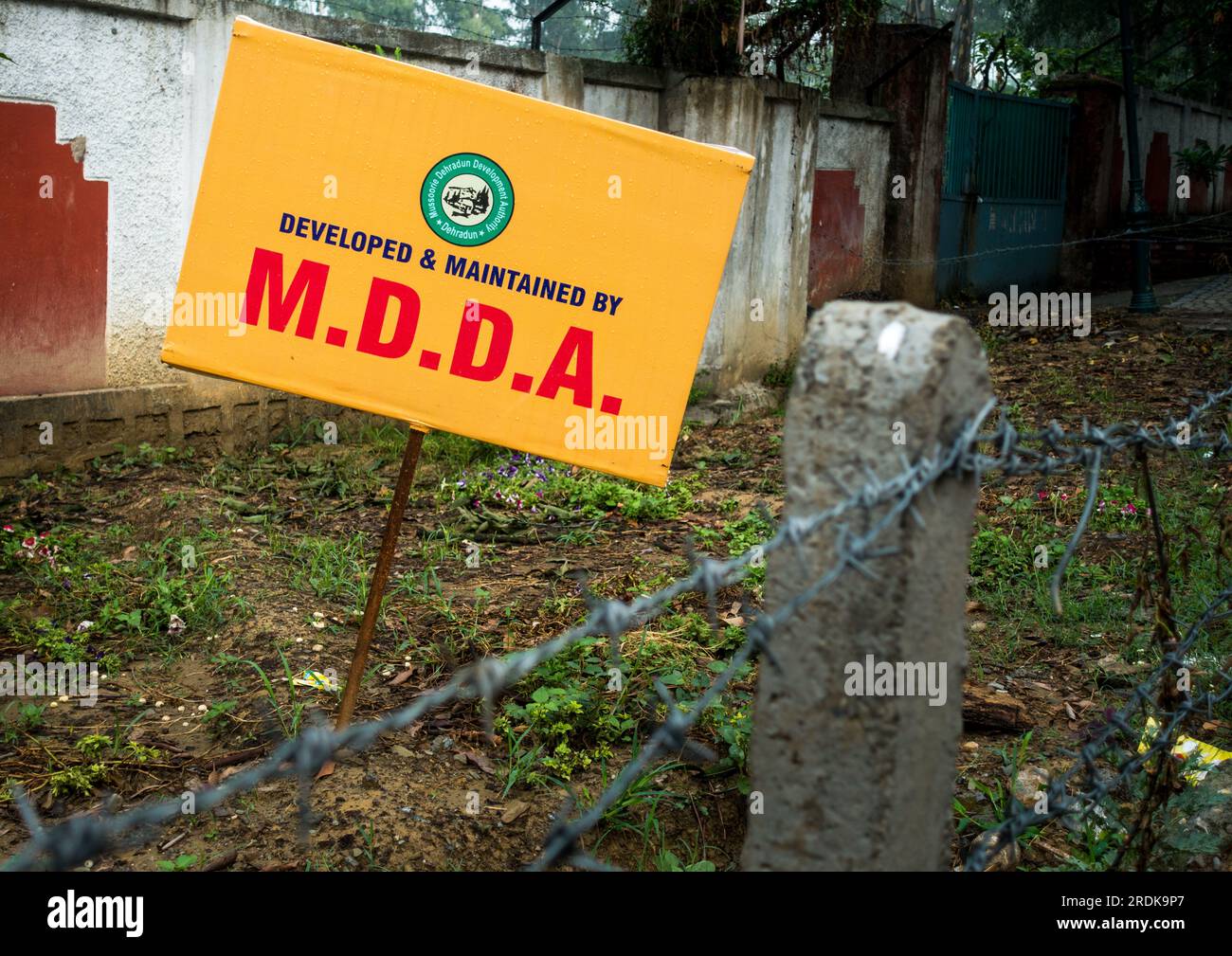 June 28th 2023, Uttarakhand, India. M.D.D.A sign board on a roadside in Rajpur Road , Dehradun City. This body is responsible for all kinds of constru Stock Photo