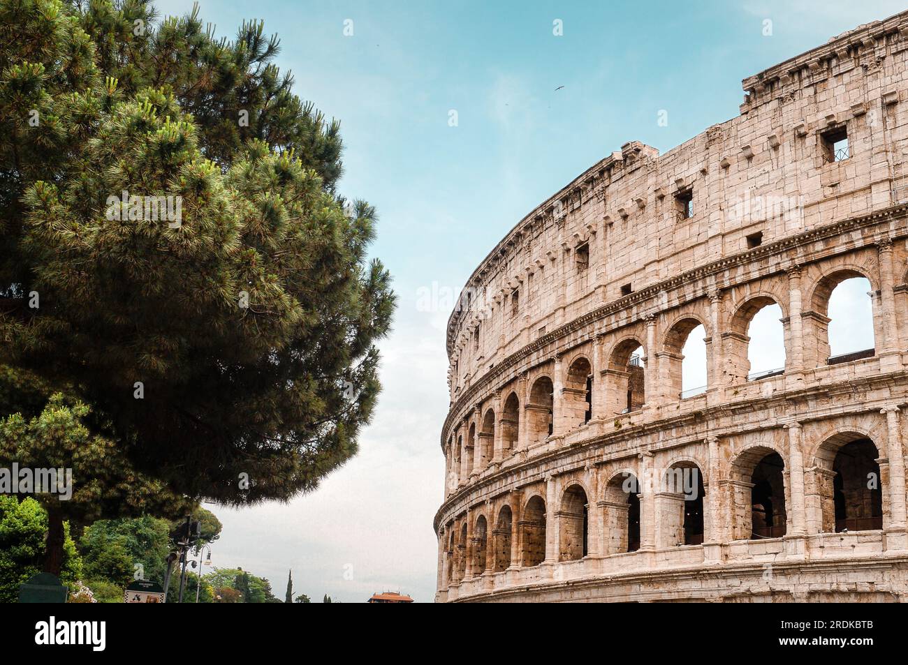 View of the Colosseum in the rays of the sun. Ancient Amphitheater in ...