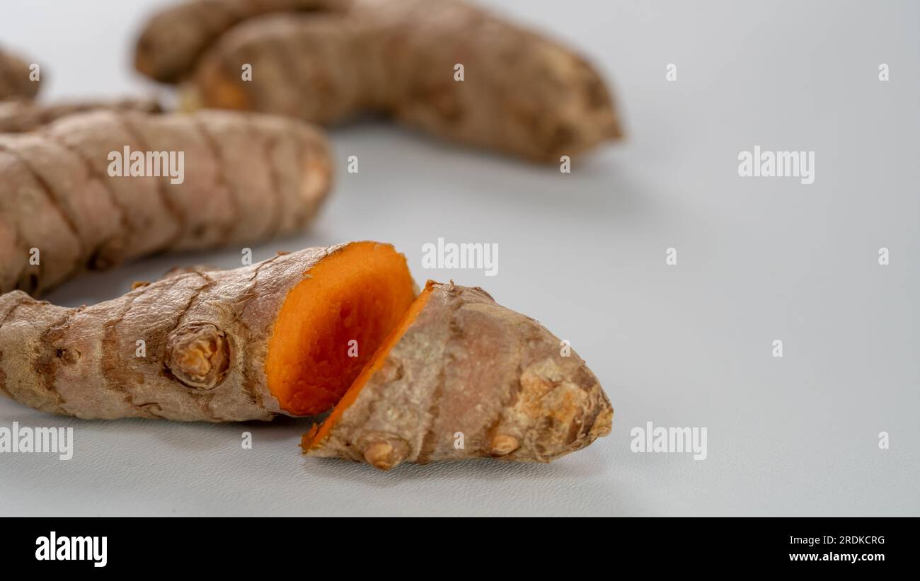 Turmeric (Curcuma longa Linn) rhizome (root) sliced isolated on white