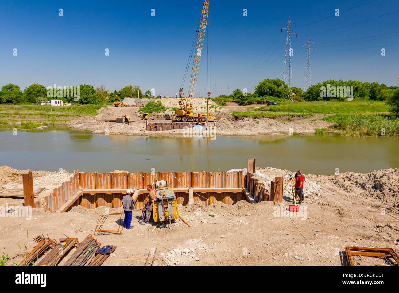 Bridge foundation made of metal piles, compressor, armature at