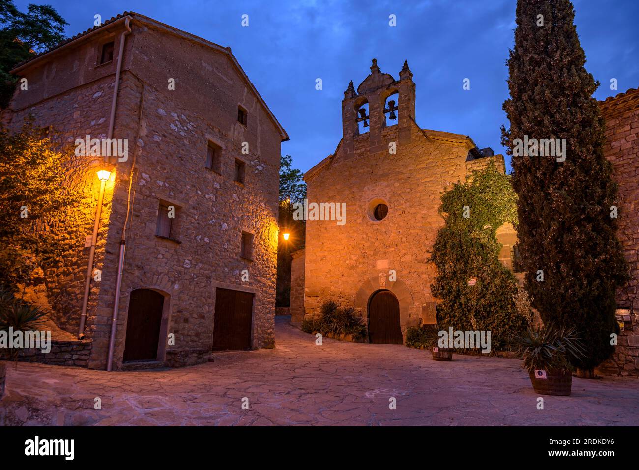 Church of Santa Maria, in Montsoriu, illuminated at blue hour and at night (La Noguera, Lleida, Catalonia, Spain) Stock Photo