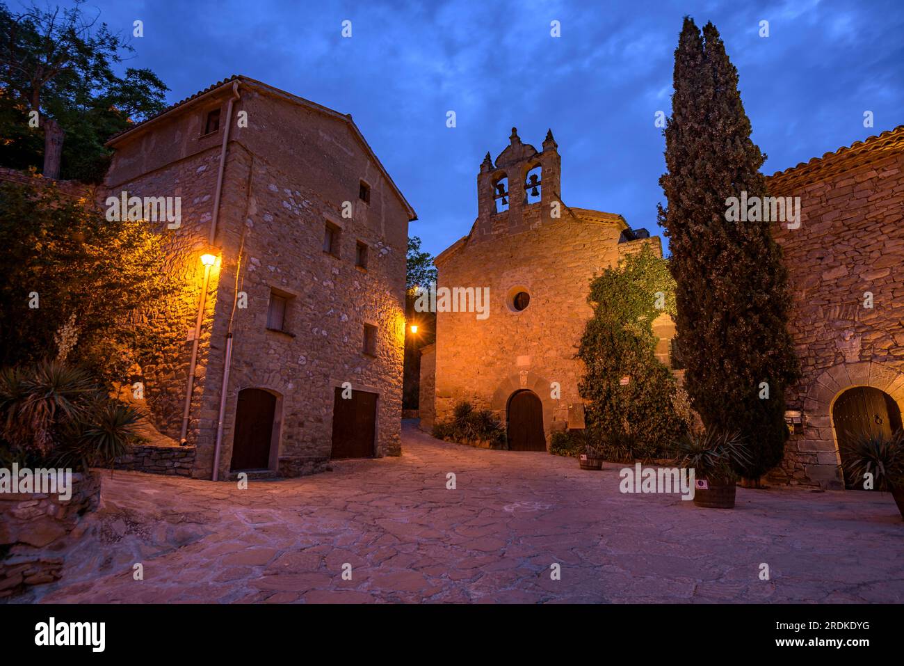 Church of Santa Maria, in Montsoriu, illuminated at blue hour and at night (La Noguera, Lleida, Catalonia, Spain) Stock Photo