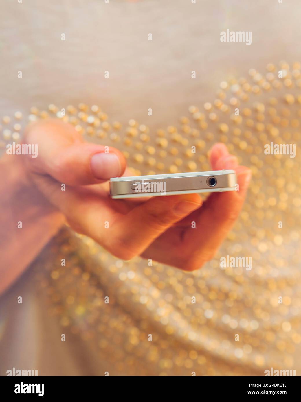 Woman's hand holding smart phone. Stock Photo