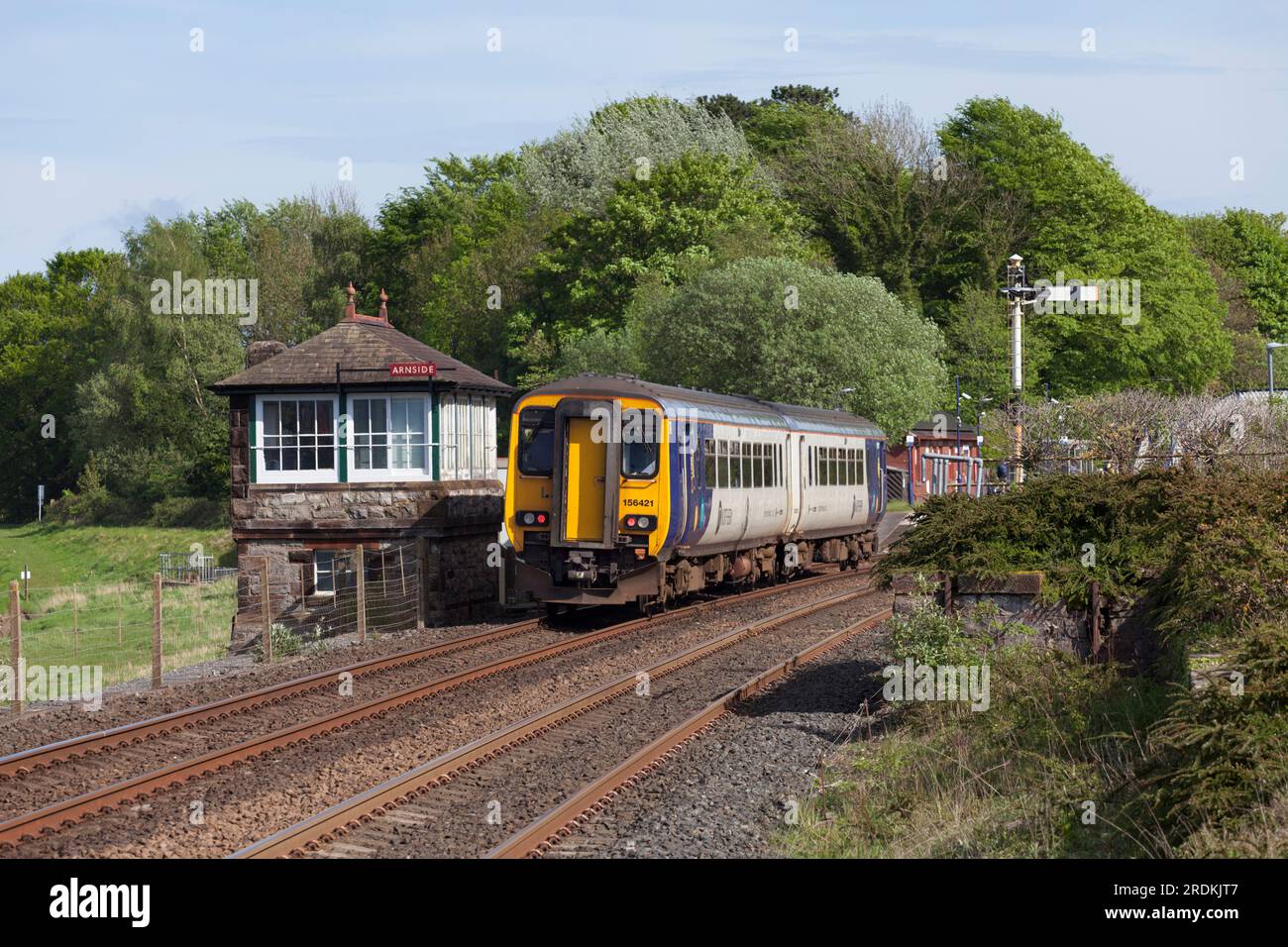 Northern rail class 156 sprinter train at Arnside with the signal box ...