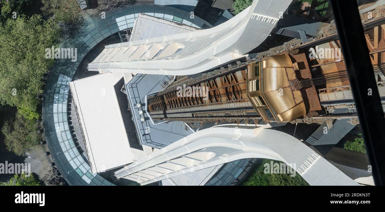 The Space Needle looking down at the elevator (lift) and the entrance on the south side through the glass floor, Seattle, Washington, USA Stock Photo