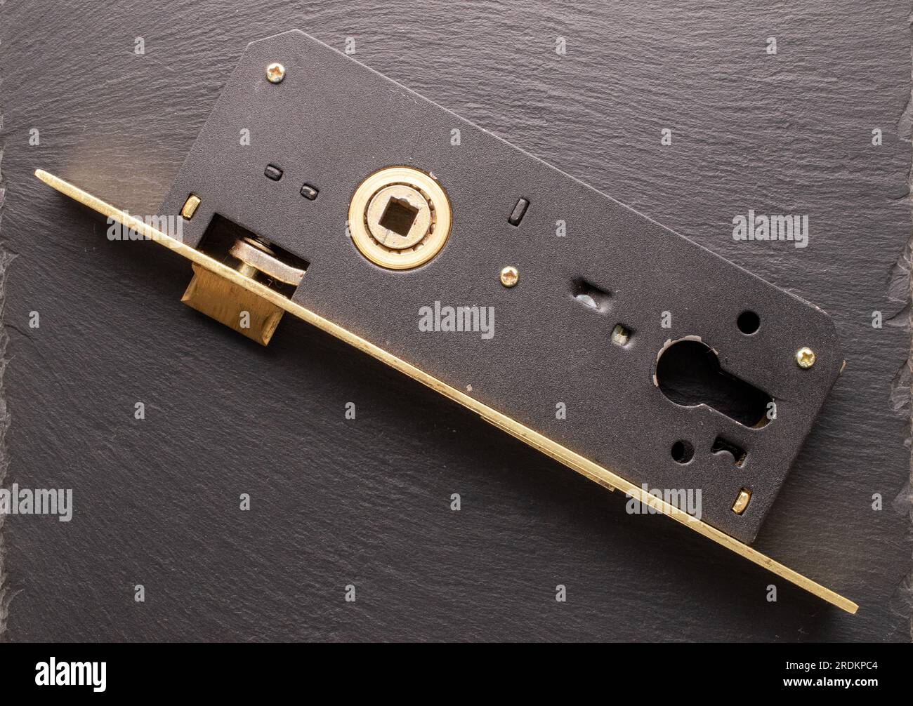 One mortise lock to a door on slate stone, closeup, top view Stock