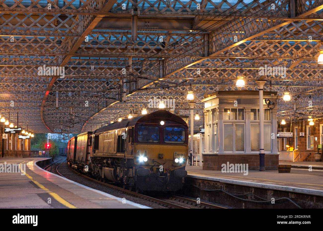 DB Cargo rail class 66 diesel 66063 passing the station at