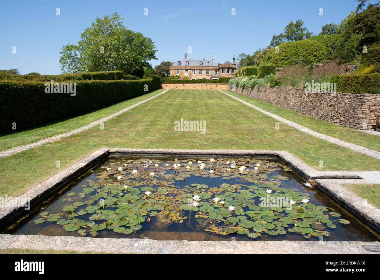 The Newt Somerset Hadspen House and the lilly pond Stock Photo