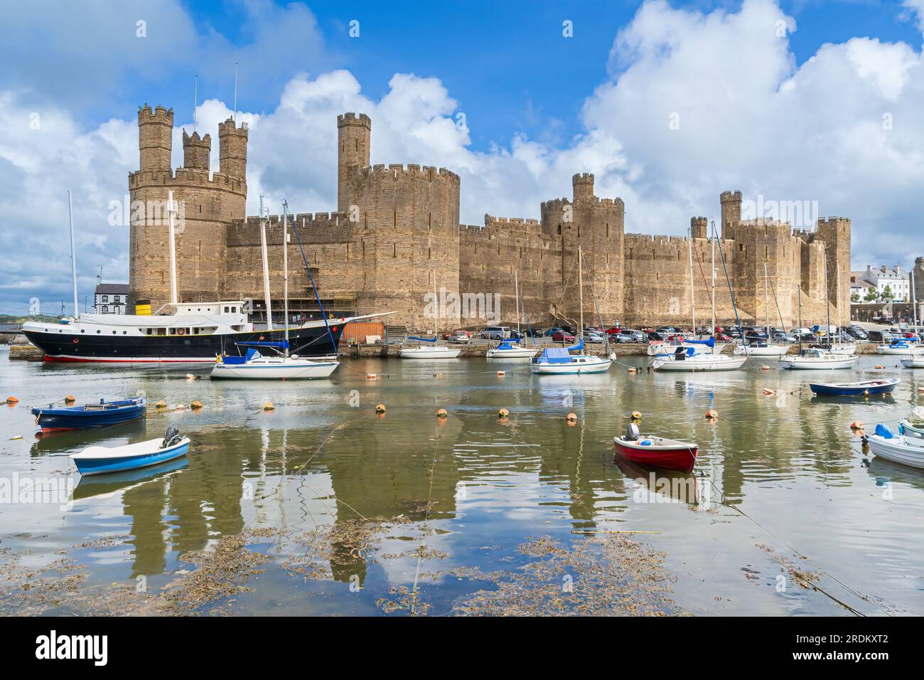 Caernarfon Castle on the Seiont River and the Menai Strait in North Wales Stock Photo