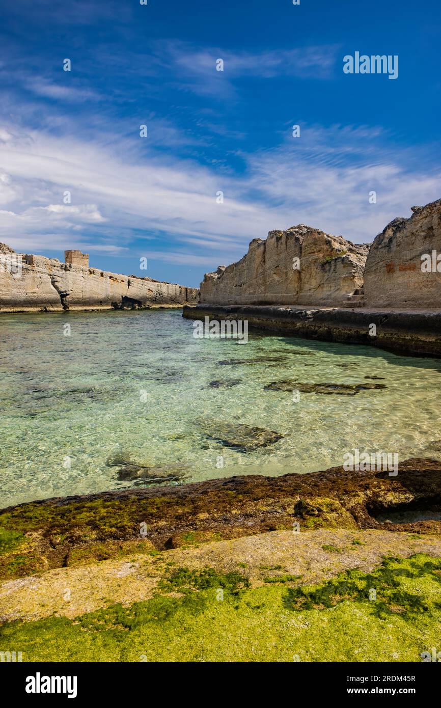 The amazing natural pools of Marina Serra, in Puglia, Salento, Tricase. The clear and crystalline turquoise sea, between the rocky cliff. The blue sky Stock Photo