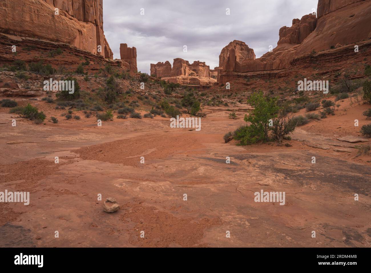 hiking the park avenue trail on a cloudy day in arches national park, utah, usa Stock Photo
