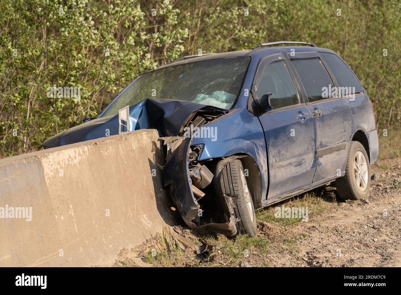 Crash. The car crashed into a concrete fence. Damage and car insurance Stock Photo