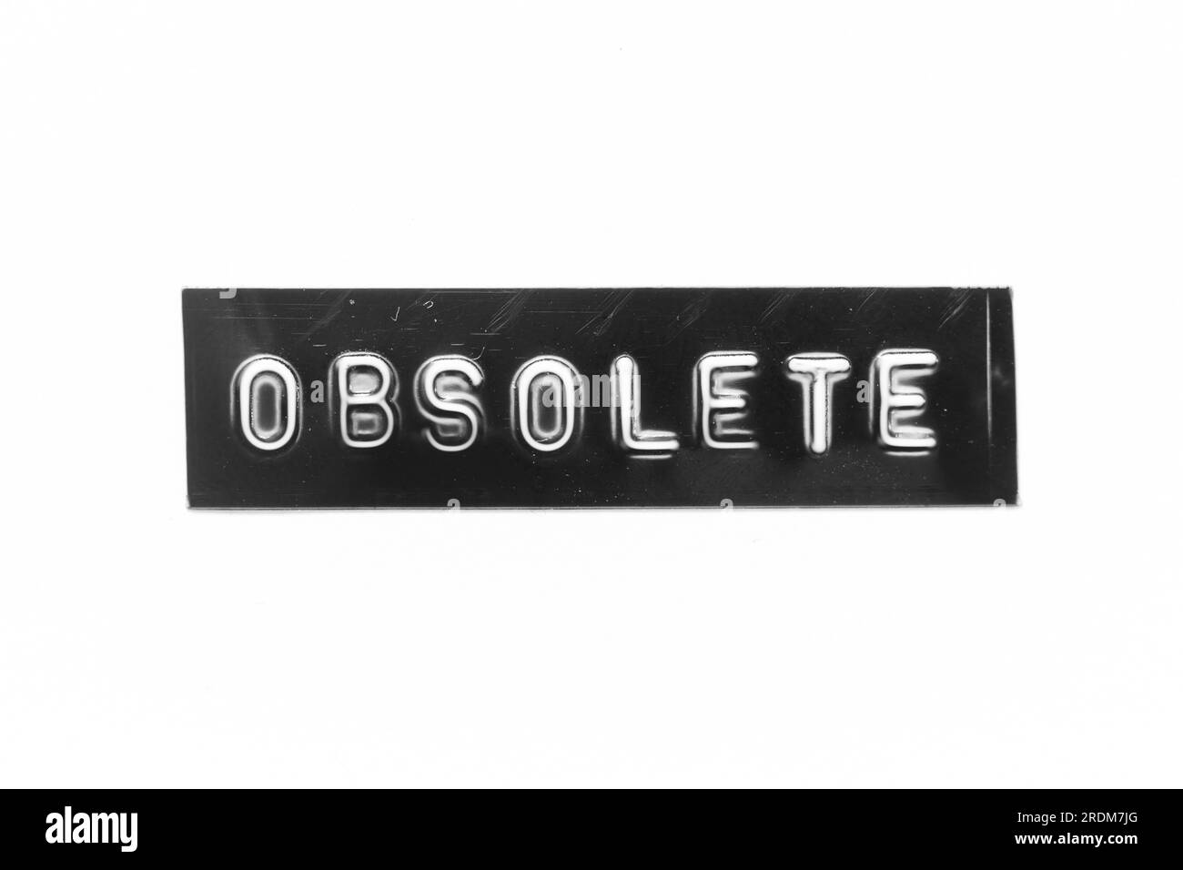 Black color banner that have embossed letter with word obsolete on