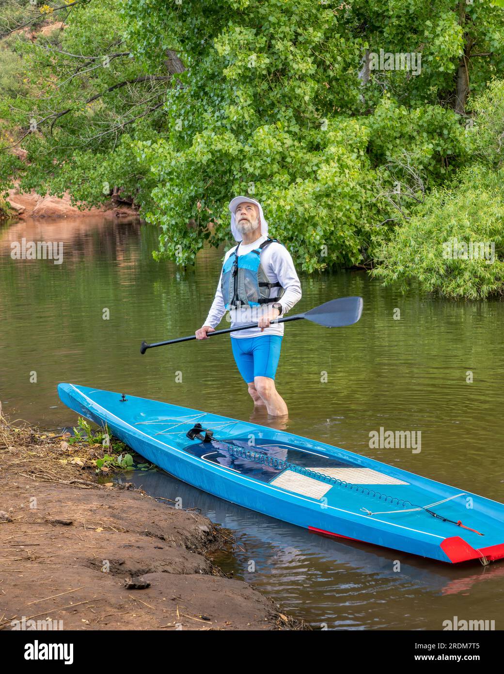 senior male with stand up paddleboard, Horsetooth Reservoir near Fort