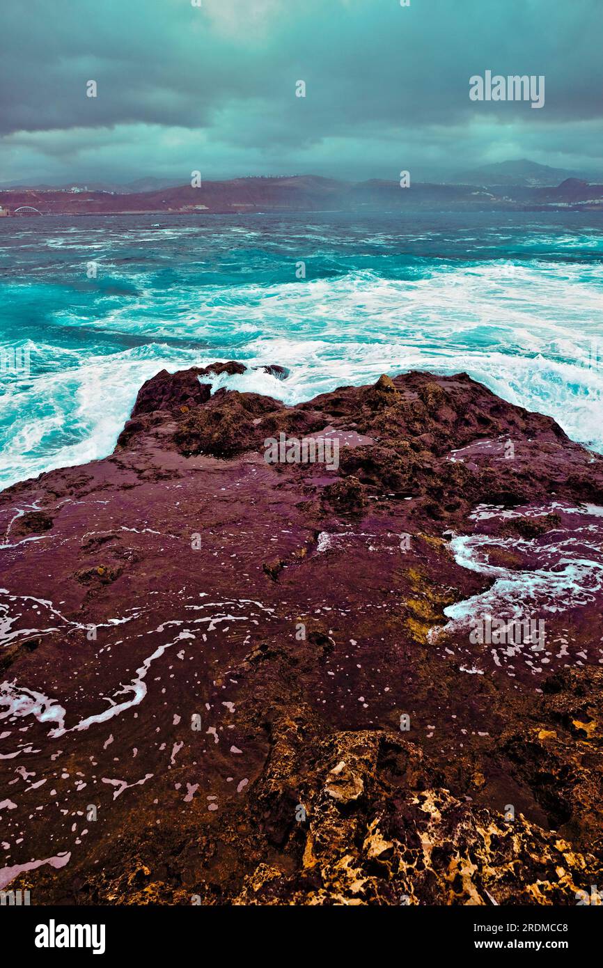 Rocky outcrop and stormy ocean landscape, winter weather in the Atlantic. Stock Photo