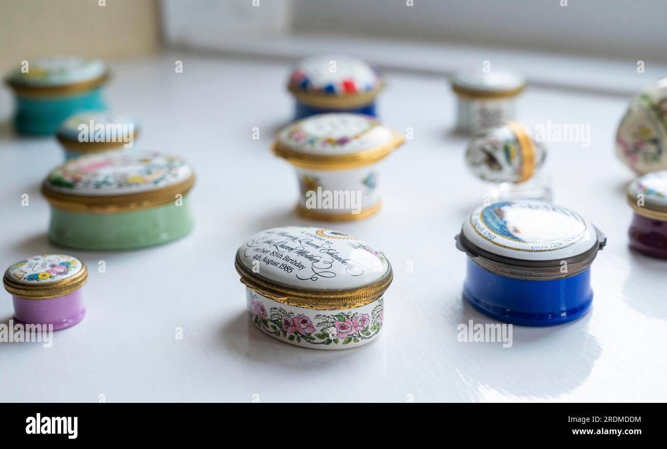 Halcyon Days collectable enamel pots on a windowsill UK Stock Photo
