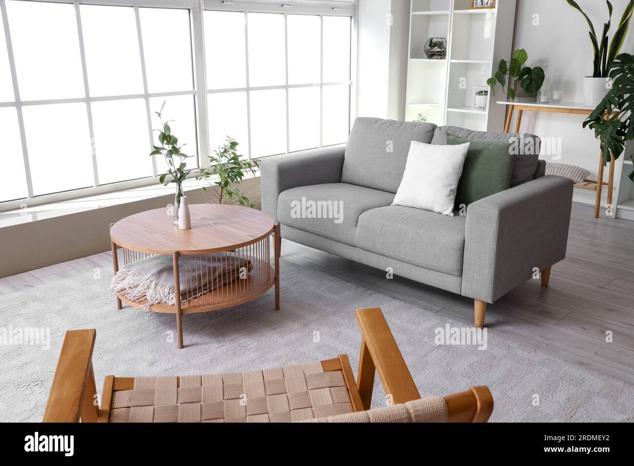 Interior of bright living room with coffee table, cozy sofa and ...