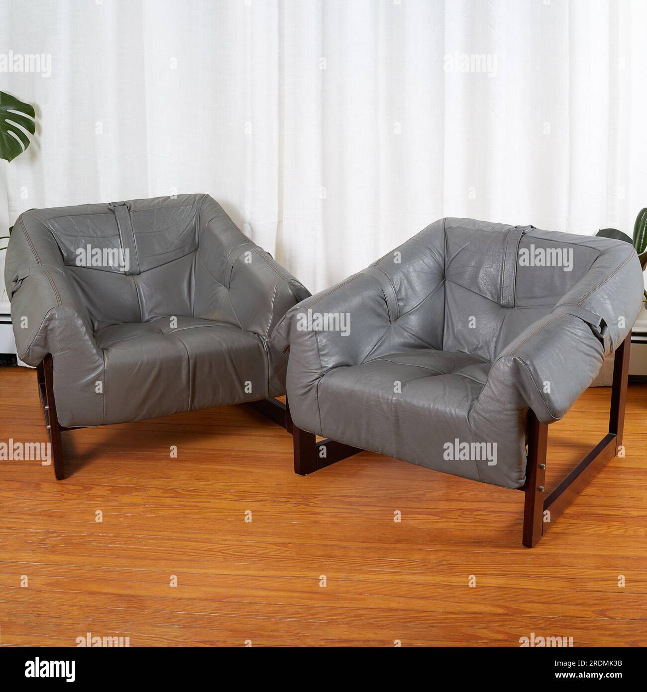 Grey leather lounge chairs. Midcentury vintage living room furniture