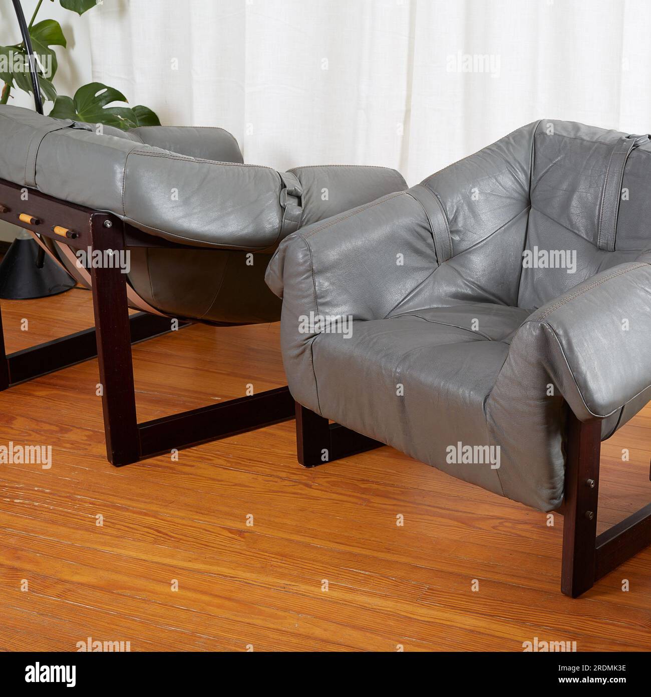 Grey leather lounge chairs. Midcentury vintage living room furniture