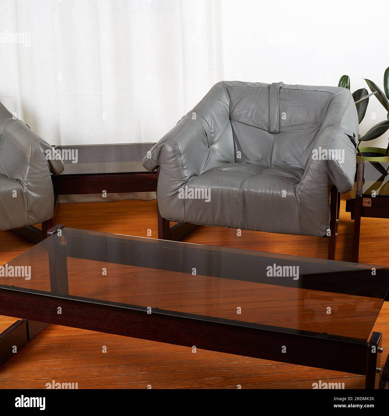 Grey leather lounge chairs. Midcentury vintage living room furniture