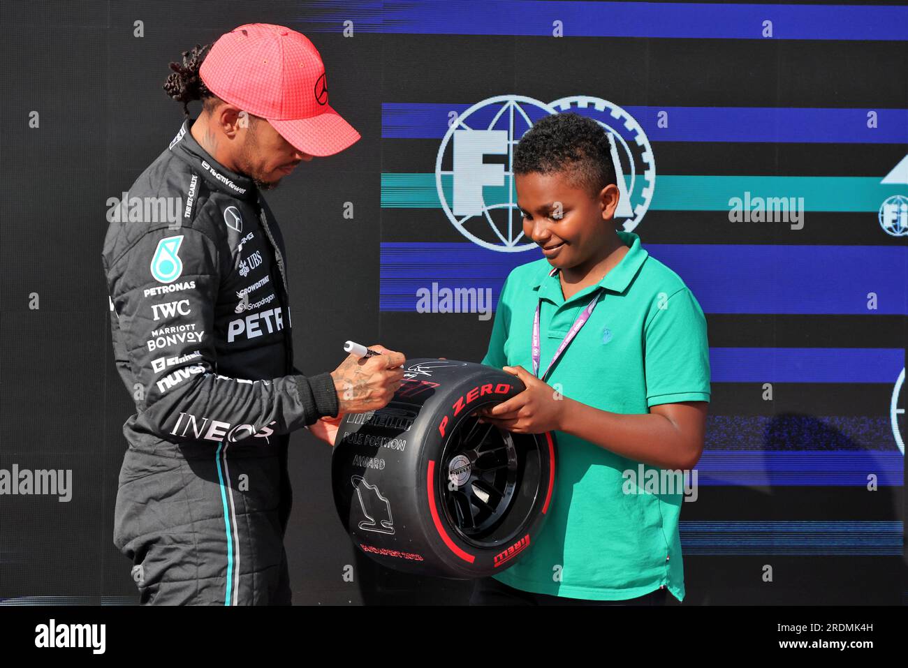 Budapest, Hungary. 22nd July, 2023. (L to R): Lewis Hamilton (GBR) Mercedes AMG F1 receives the Pirelli Pole Position Award from Zac (GBR) Sky F1 Junior Presenter. 22.07.2023. Formula 1 World Championship, Rd 12, Hungarian Grand Prix, Budapest, Hungary, Qualifying Day. Photo credit should read: XPB/Press Association Images. Credit: XPB Images Ltd/Alamy Live News Stock Photo