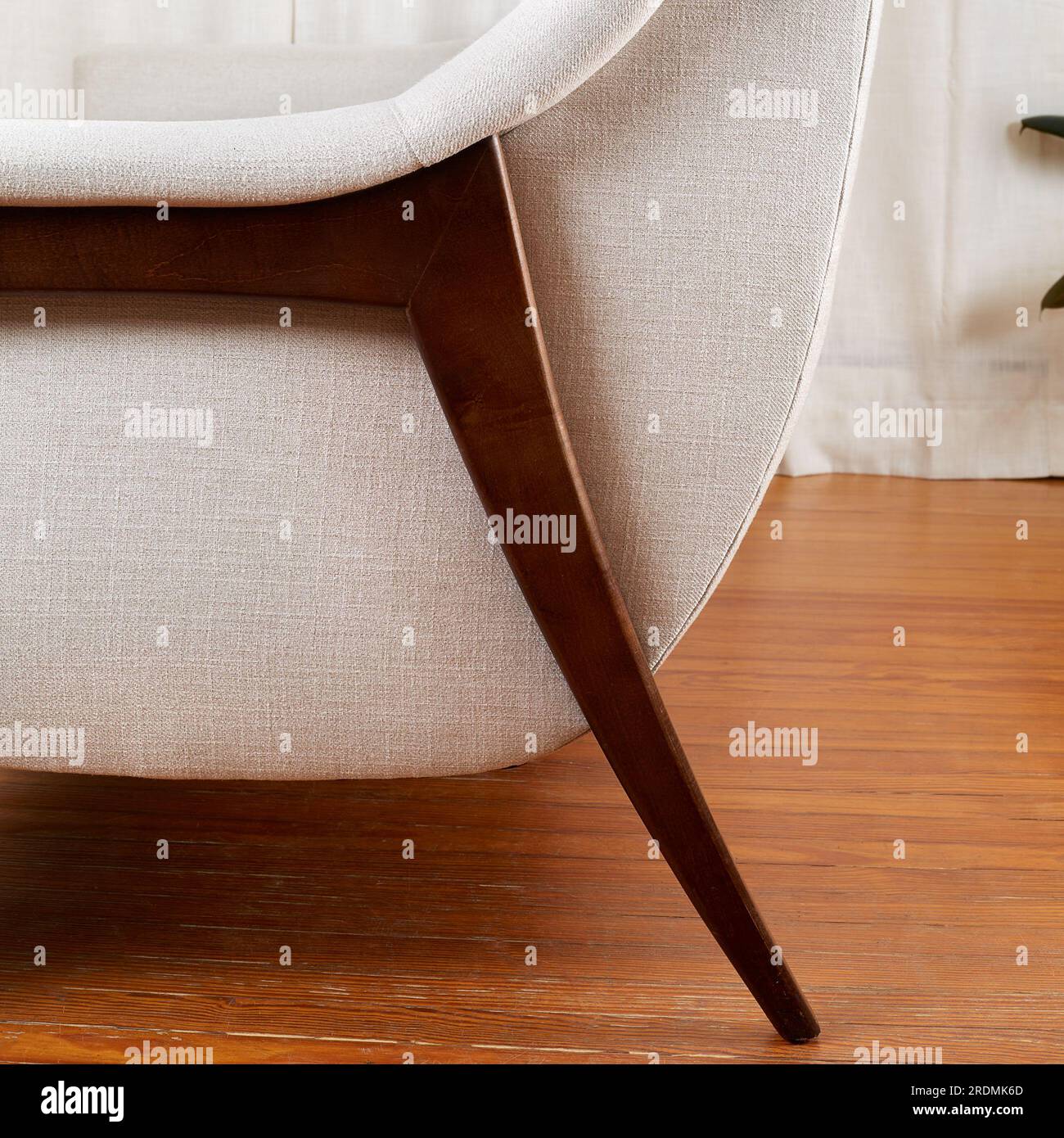 Vintage white sofa. Stylish midcentury modern couch with sculptural