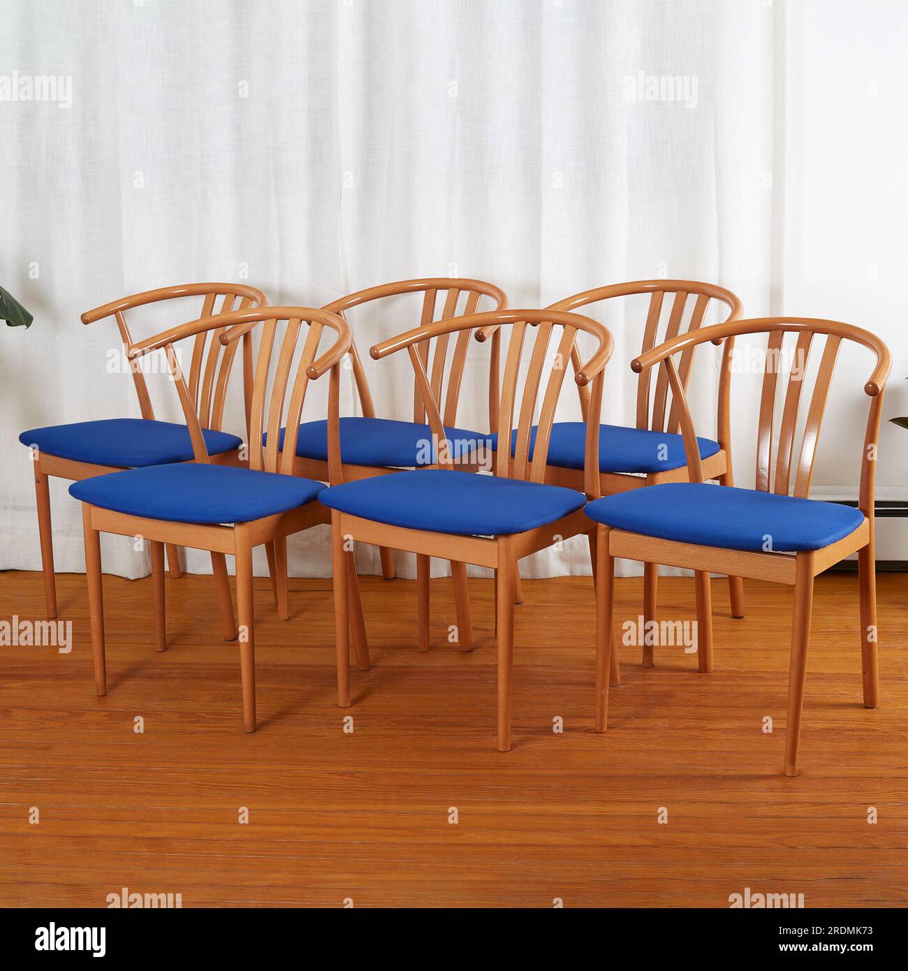 Three Midcentury modern minimalist wooden chairs with blue seats