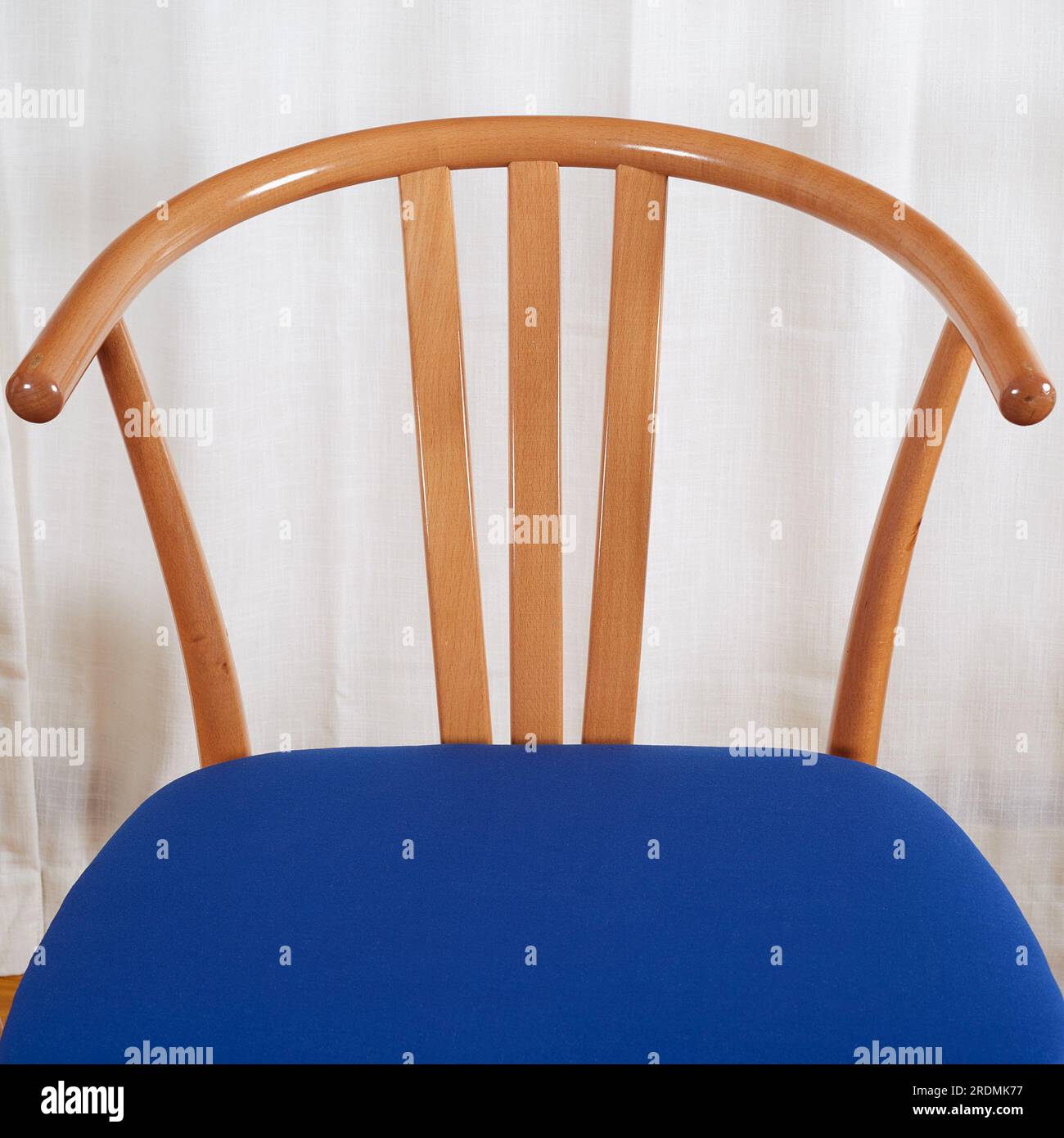 Three Midcentury modern minimalist wooden chairs with blue seats