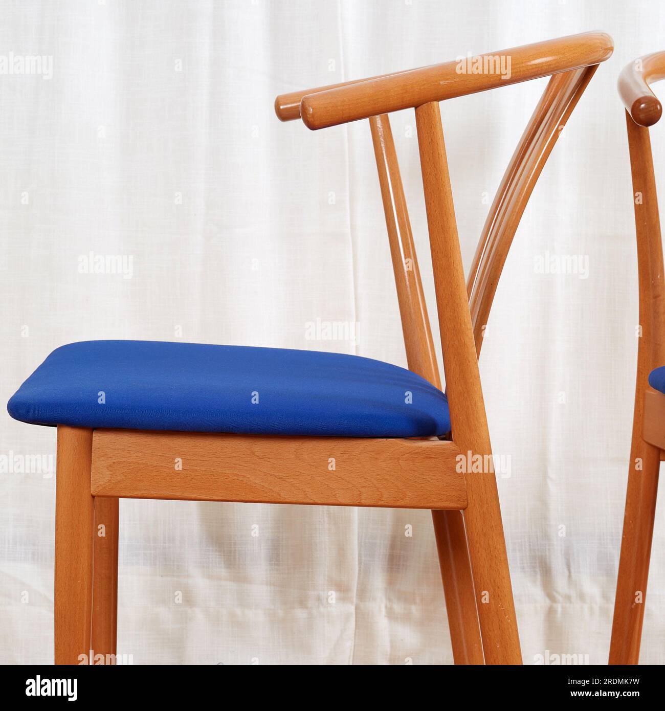 Three Midcentury modern minimalist wooden chairs with blue seats