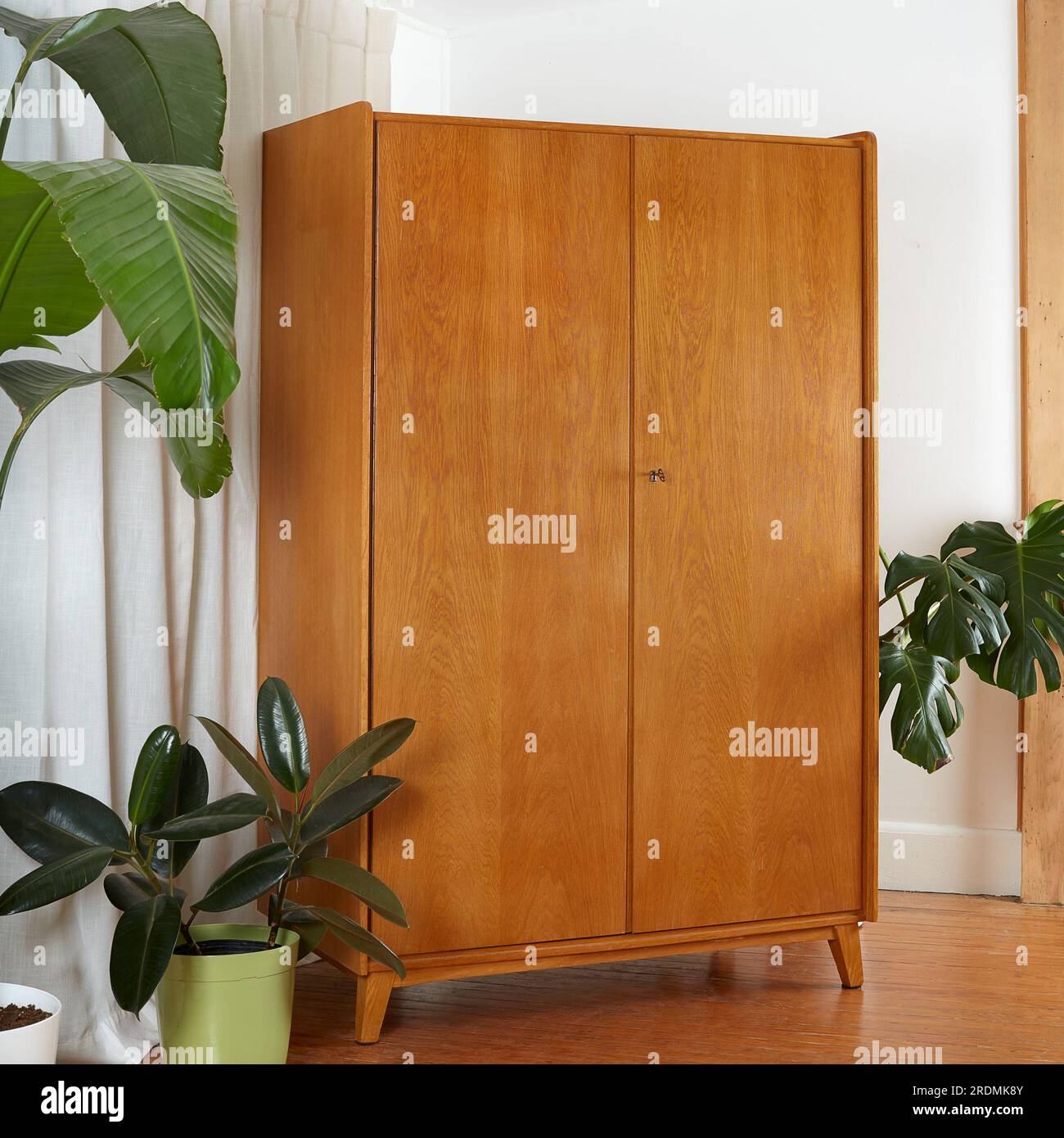 Vintage 1960s oak wood armoire. MidCentury Modern Furniture. Product photograph with large