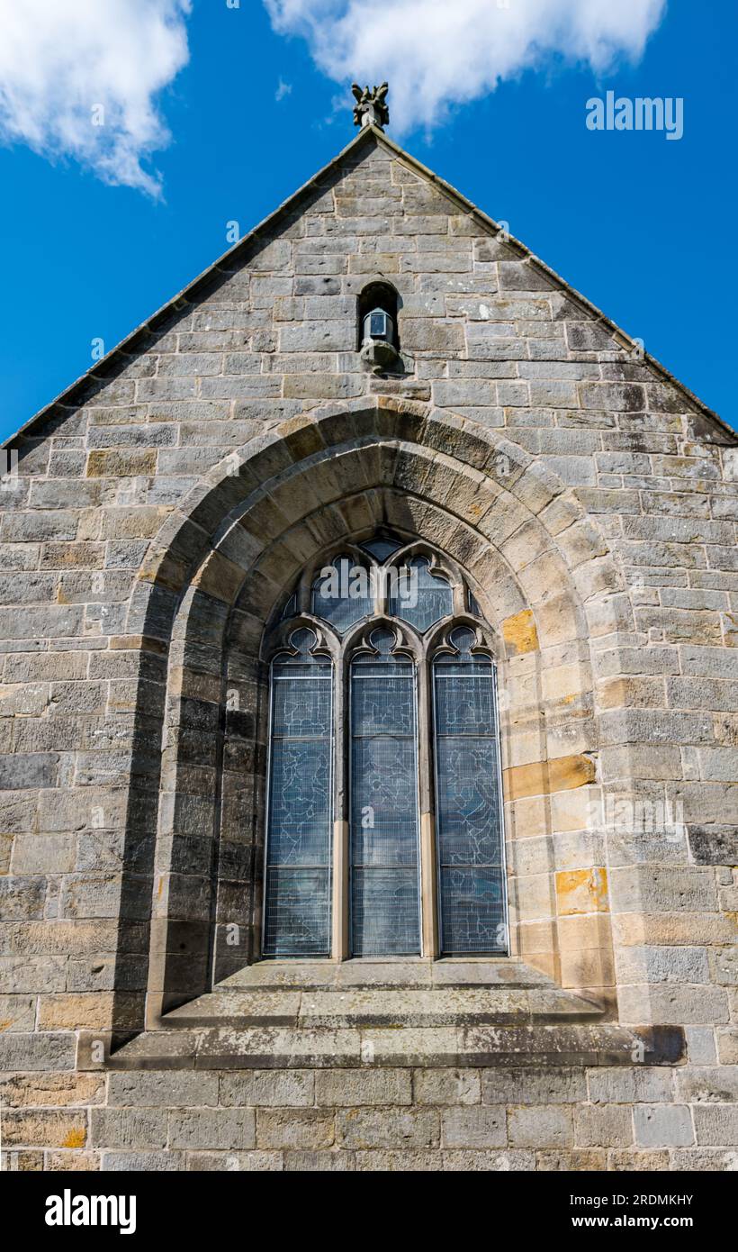 Exterior of Corstorphine Old Parish Church with stained glass window and historic lantern, Edinburgh, Scotland, UK Stock Photo