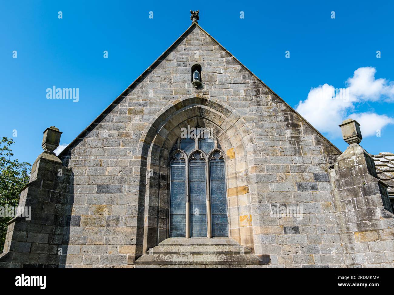 Exterior of Corstorphine Old Parish Church with stained glass window and historic lantern, Edinburgh, Scotland, UK Stock Photo