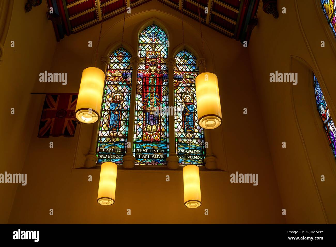 Toronto, Canada - July 19, 2023: The Cathedral Church of St. James. Stained glass window with electric lamps in the Saint George Chapel Stock Photo